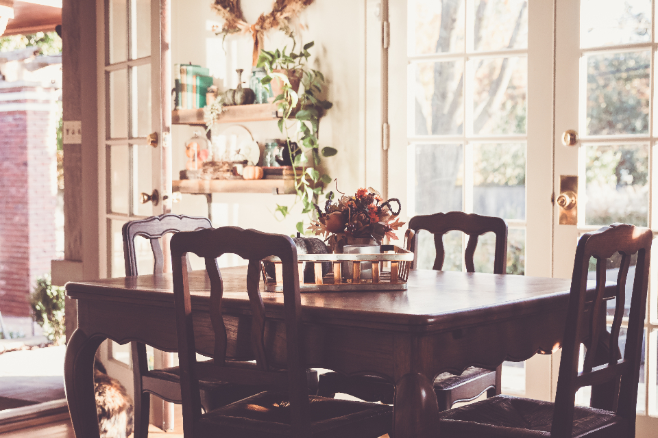 A furnished dining room with a chandelier